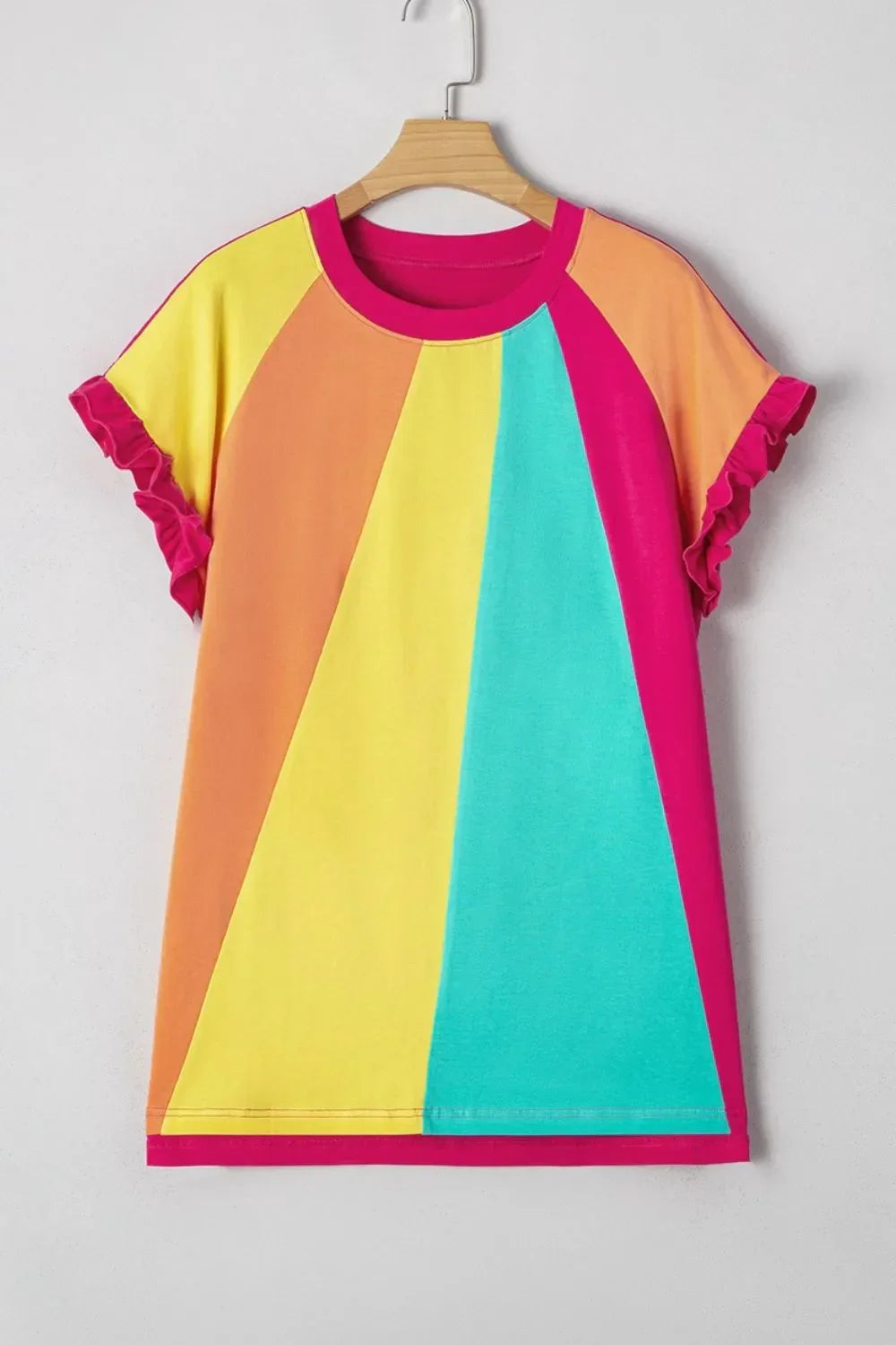 Colorblock t-shirt with yellow, orange, teal, and magenta panels, ruffle sleeves, on hanger
