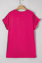 Bright pink short sleeve t-shirt with ruffle details, displayed on wooden hanger