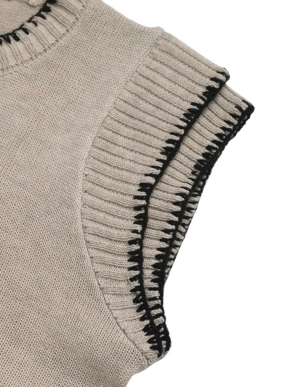 Light beige knit sleeveless top with ribbed edges and black contrast trim detail