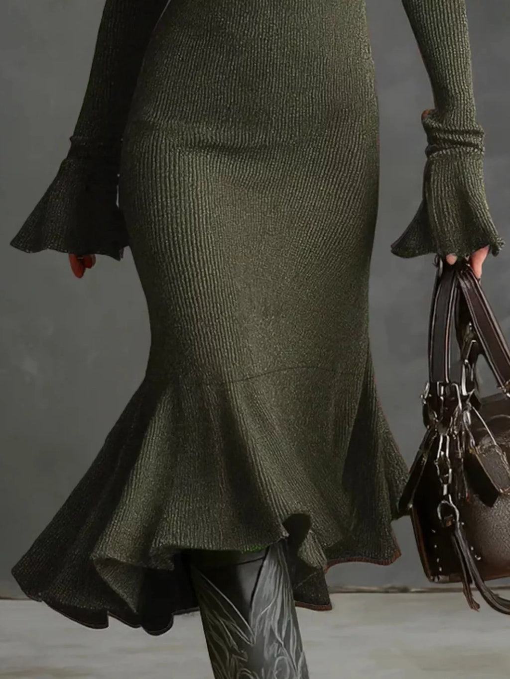 Metallic green ribbed midi dress with flared cuffs and hem, paired with black boots and bag